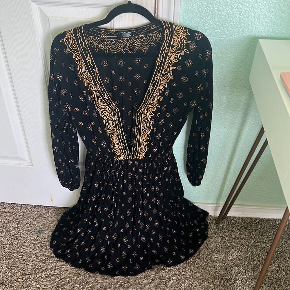 Selling black with gold detailing dress. Size is Small and slightly worn.
